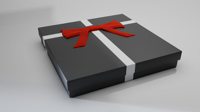 Giftwrapped framed art print with a bow on the box- Ideas For Giving Art as a Gift in 2025