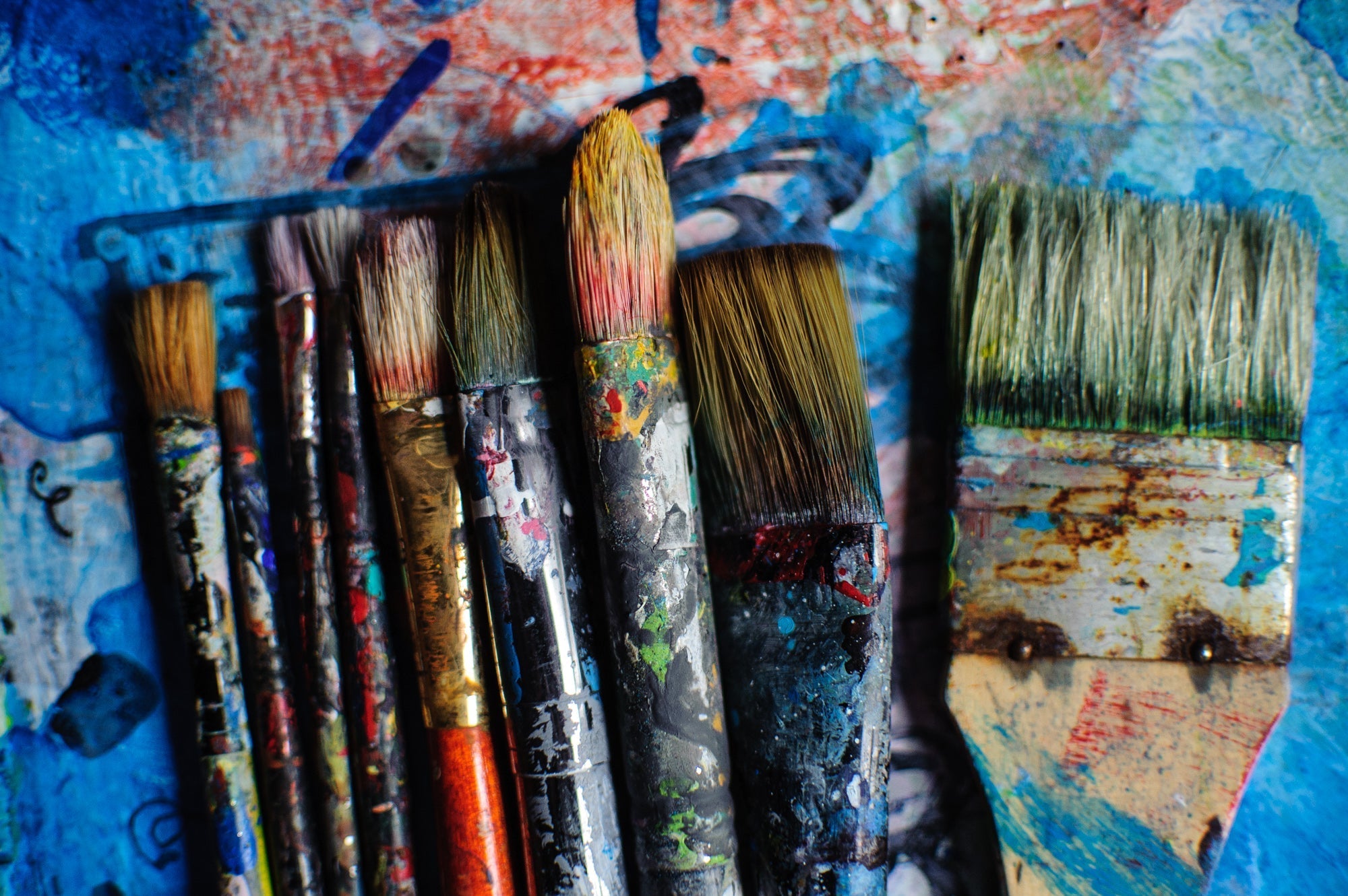 Authentic fine art brushes covered in real paint