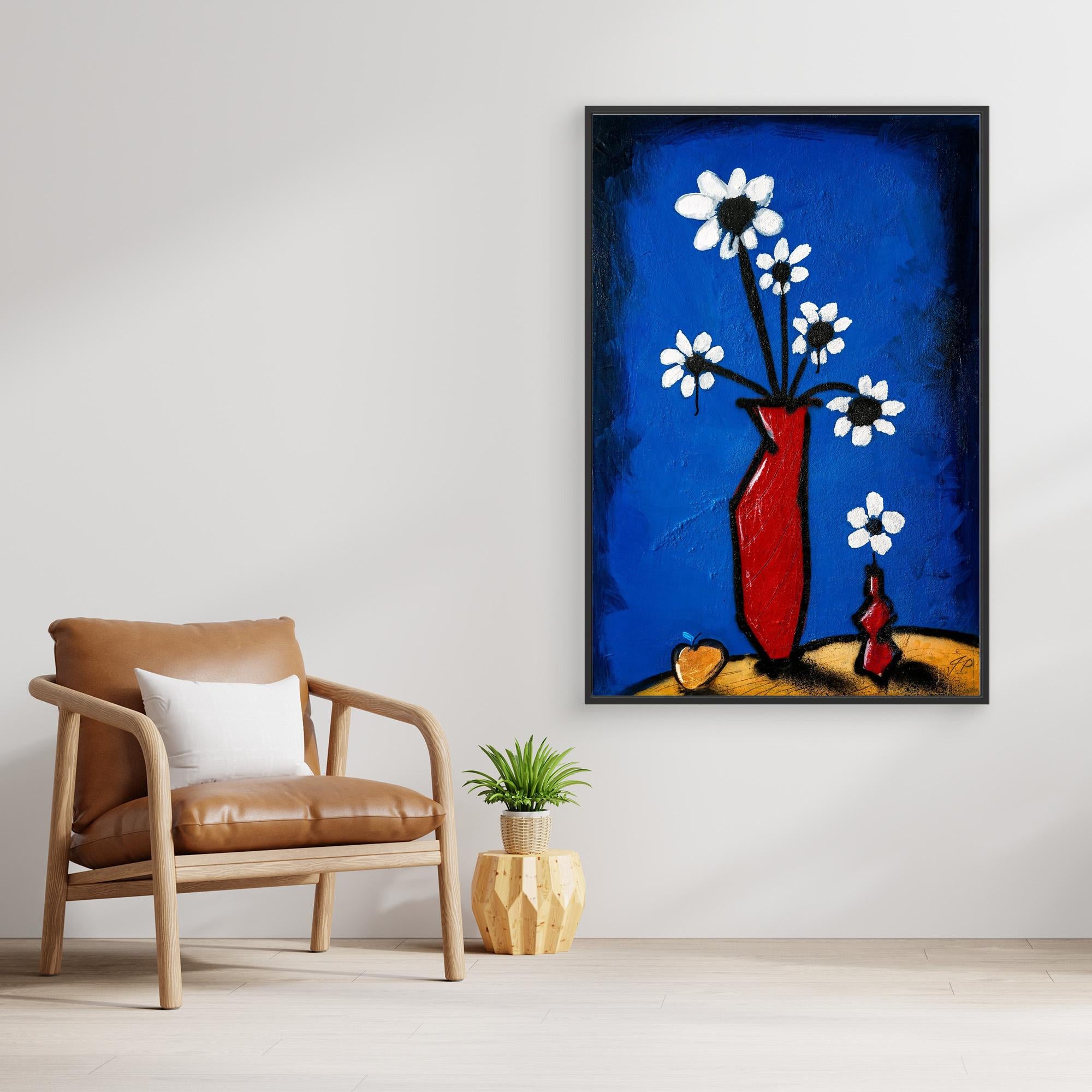 Abstract painting of white flowers in red vase, above wooden console, beige sofa, and white vase.