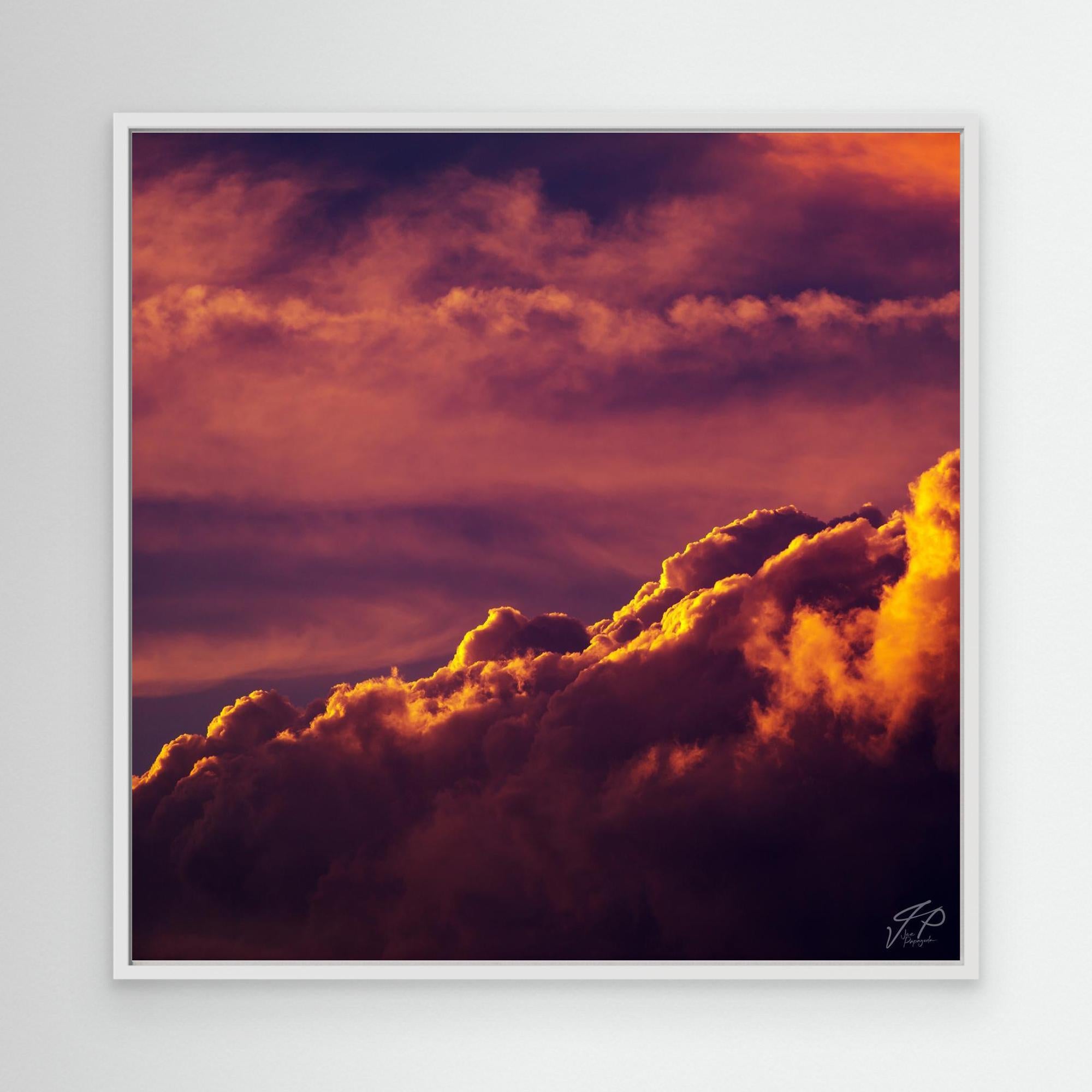 A framed canvas print of a dramatic sky with orange and dark clouds, titled 'Crimson Veil'.