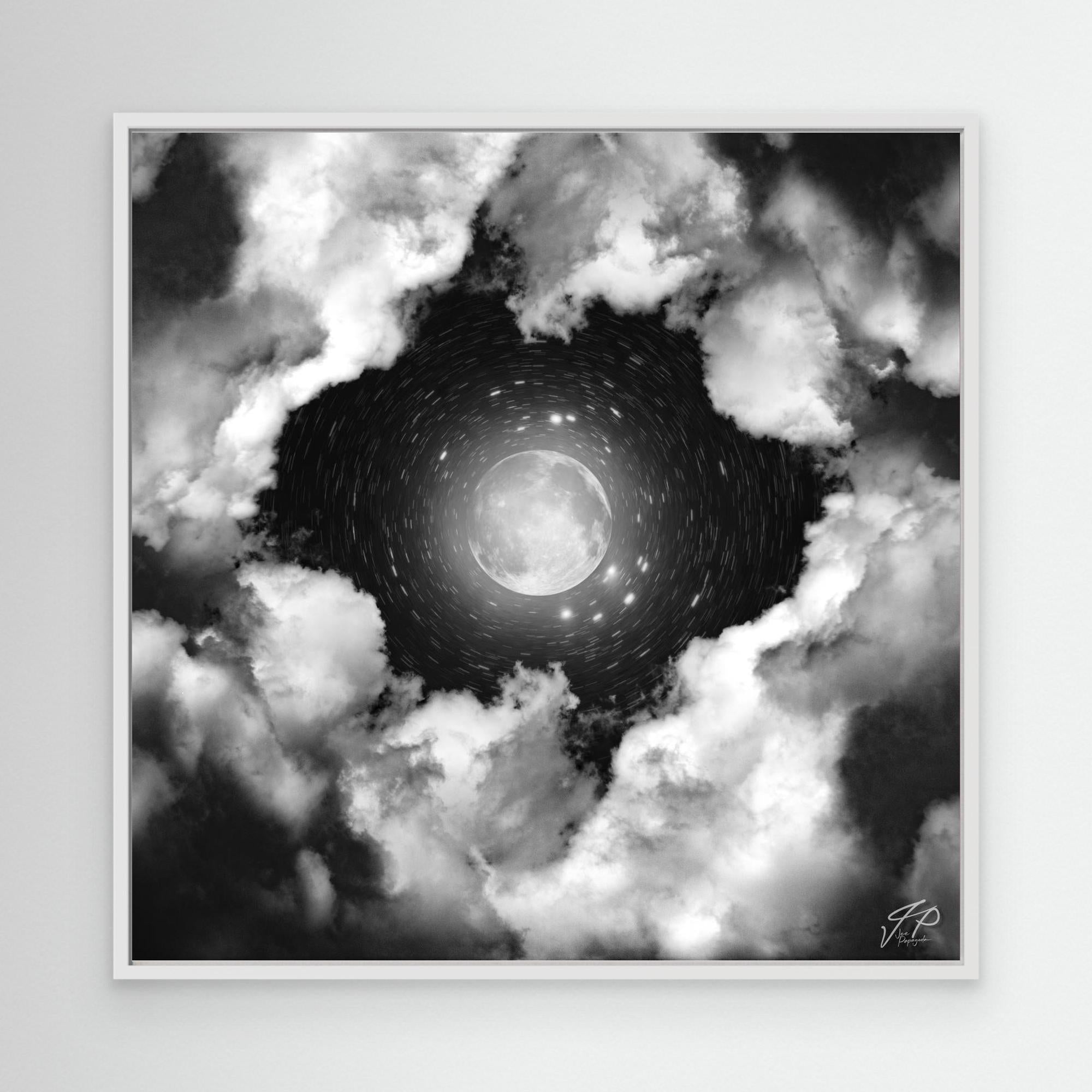 A black and white canvas print featuring a photograph with a central butterfly motif surrounded by clouds, framed elegantly.