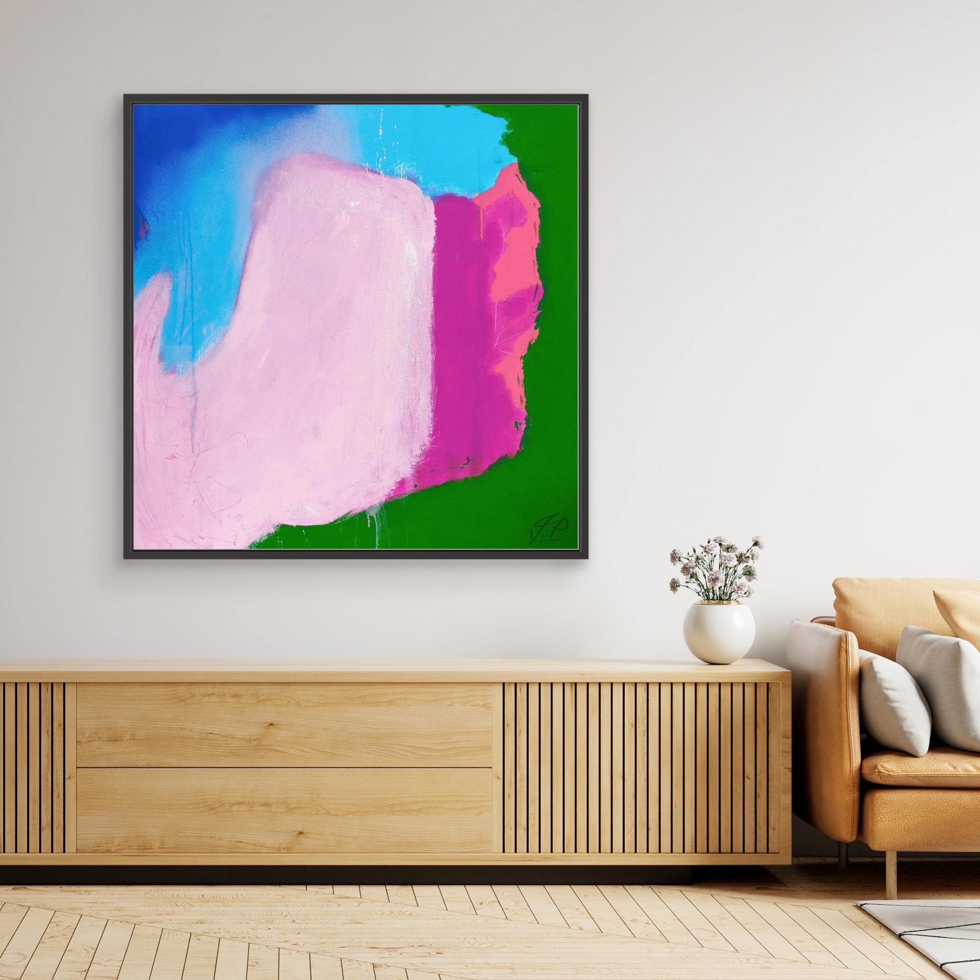 Abstract painting with pink, blue, green, and magenta shapes above wooden console table and beige sofa.