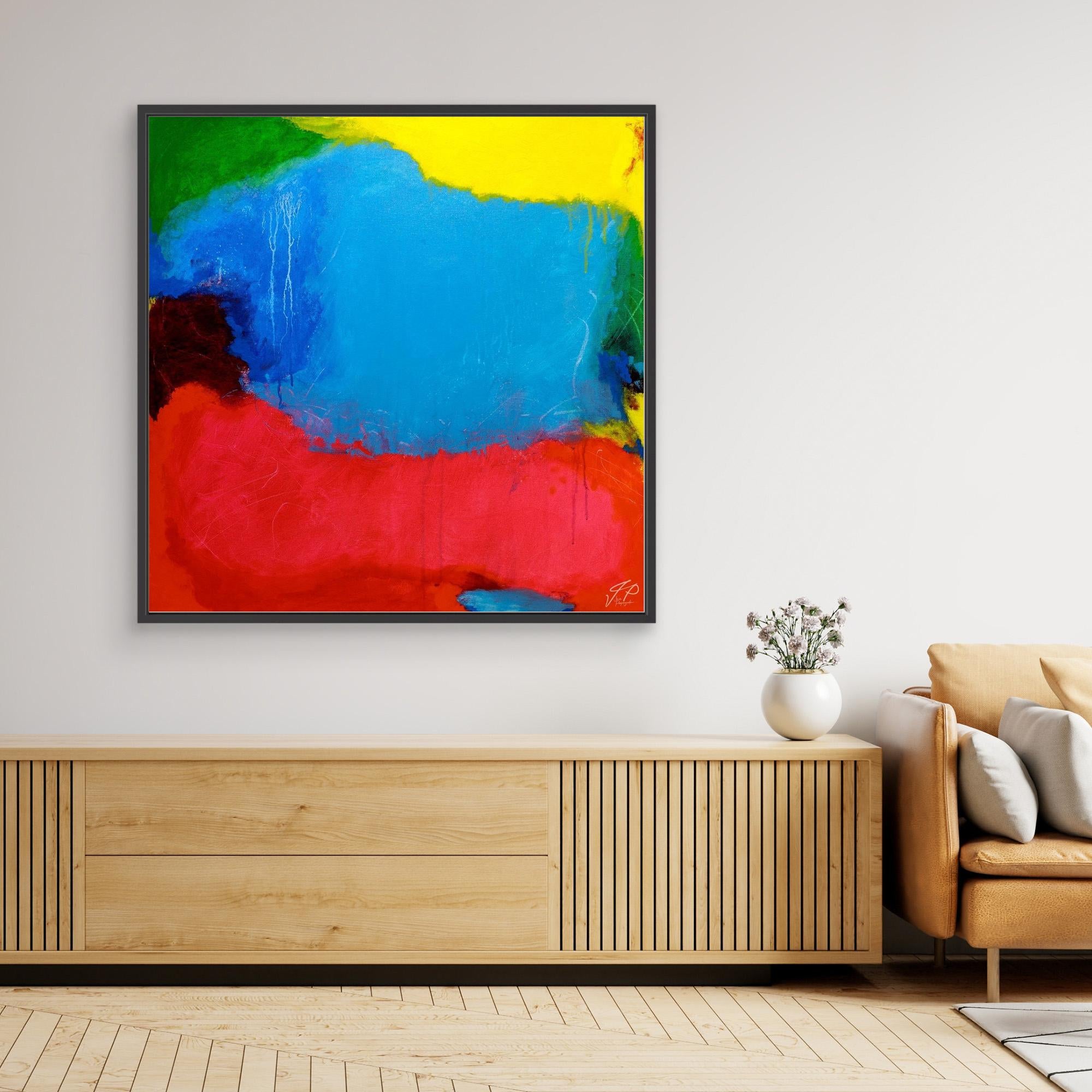 Colorful abstract painting above a wooden console, next to a beige armchair and decorative white vase.