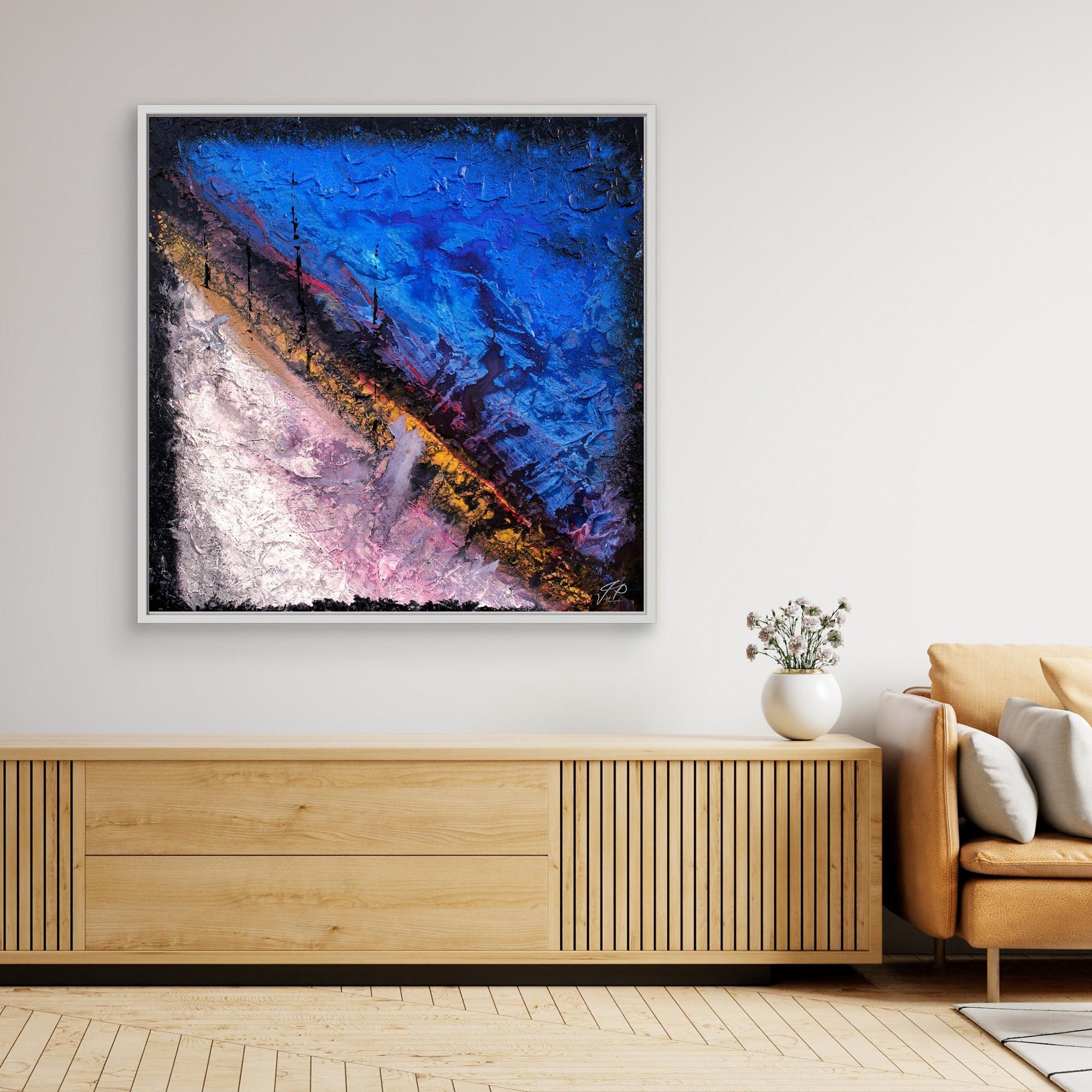 Abstract painting with textured blue, purple, white, and yellow diagonal strokes above wooden console and beige sofa.