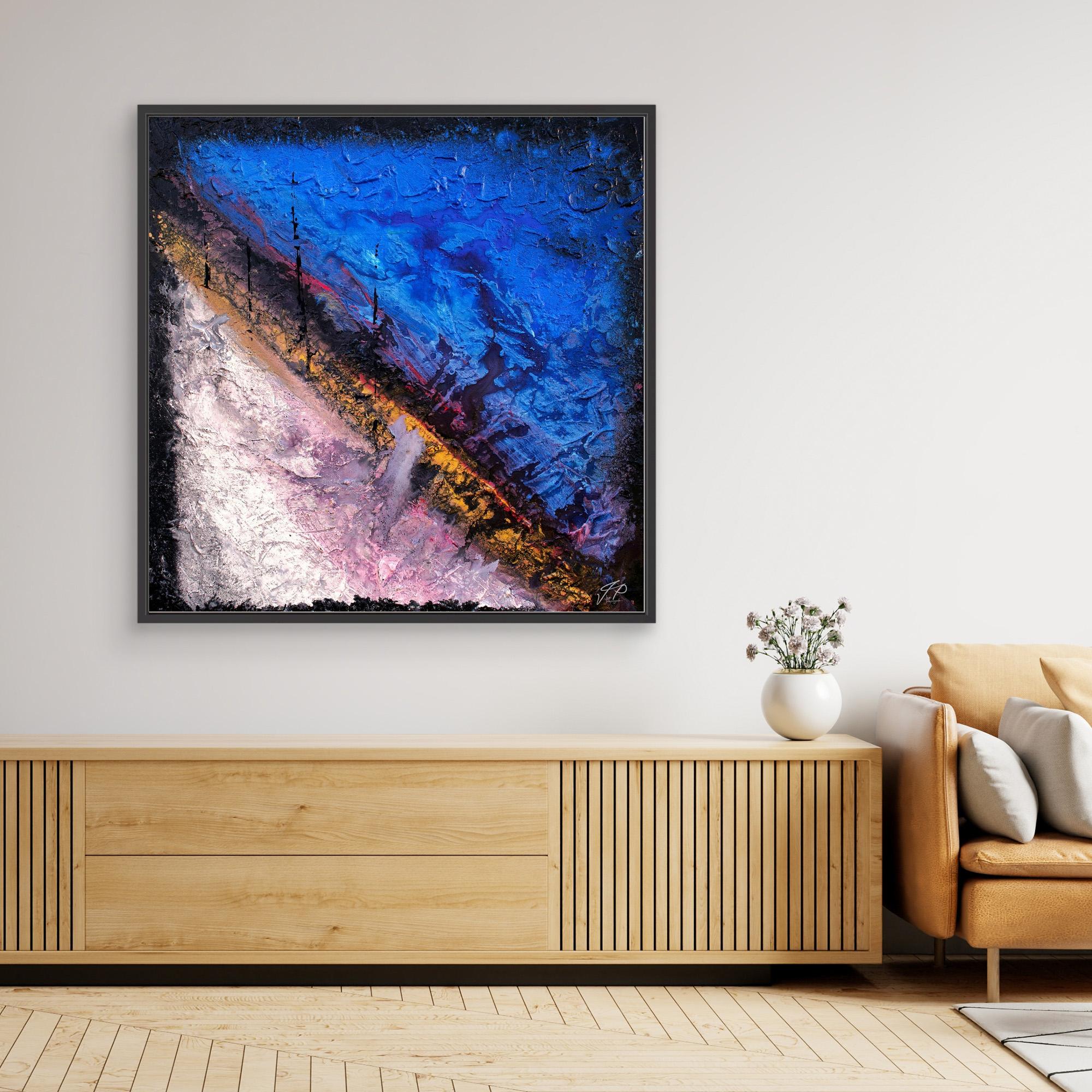 Abstract painting with textured blue, purple, white, and yellow diagonal strokes above wooden console and beige sofa.
