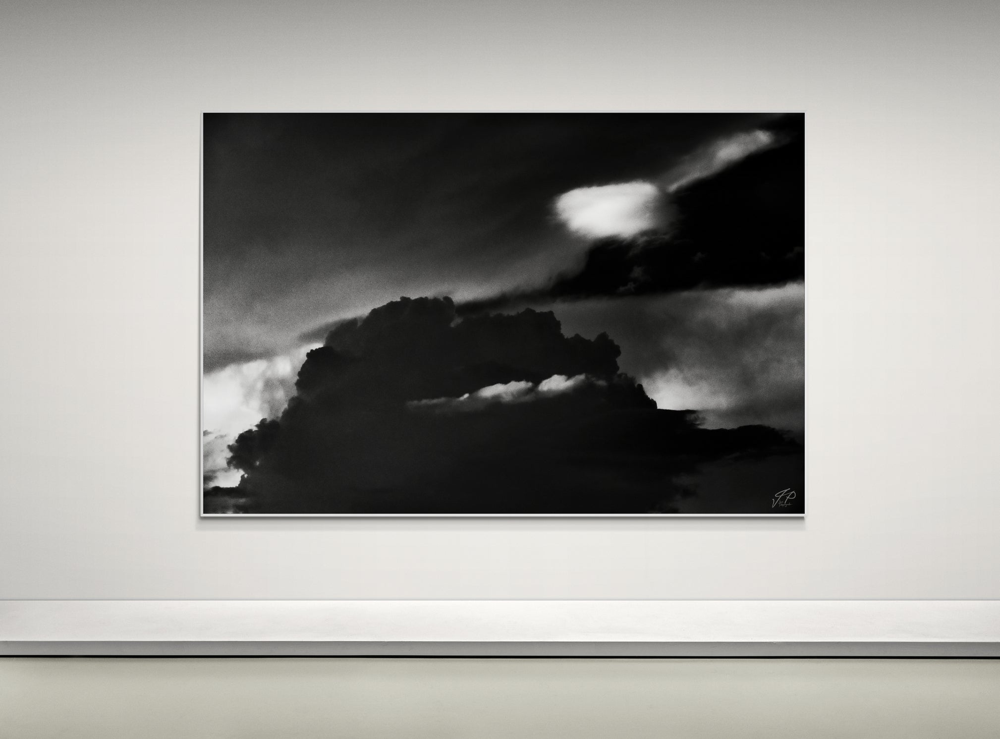 black and white art displayed on a modern art wall at home.